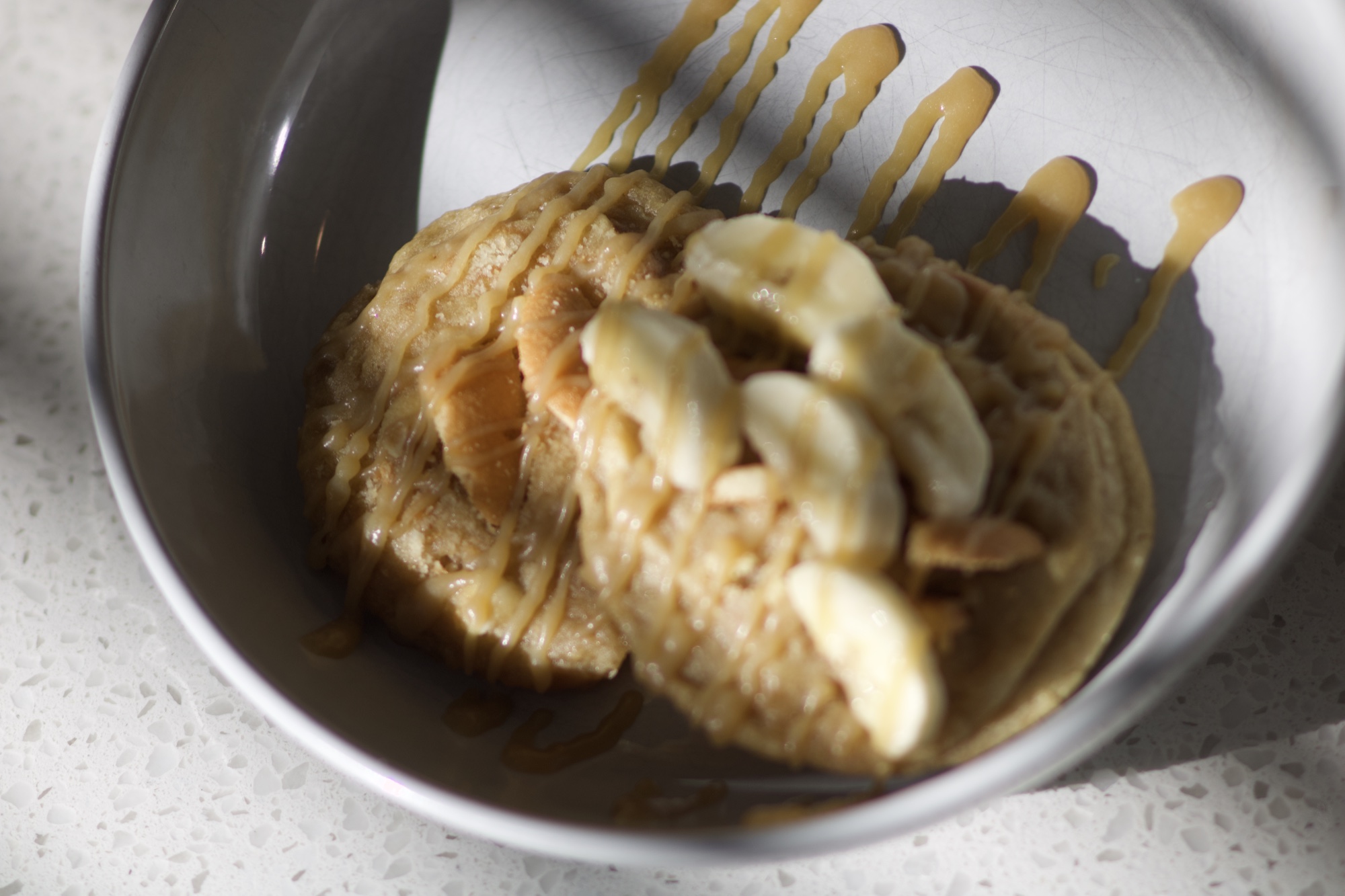 Brown Butter Banana Pudding — caramel drizzle in bowl